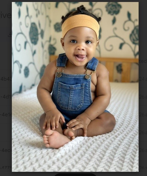 Baby in denim overalls