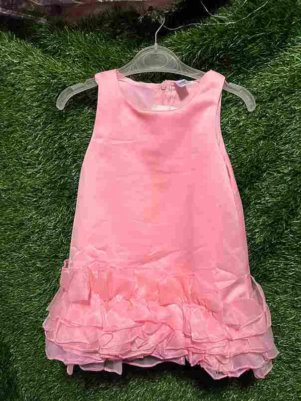 Pink sleeveless gown with ruffle trim
