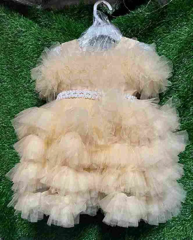 Champagne tulle layered gown with pearl waistband