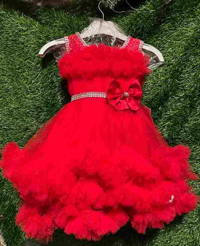 Red fluffy tulle gown with rhinestone straps and bow belt