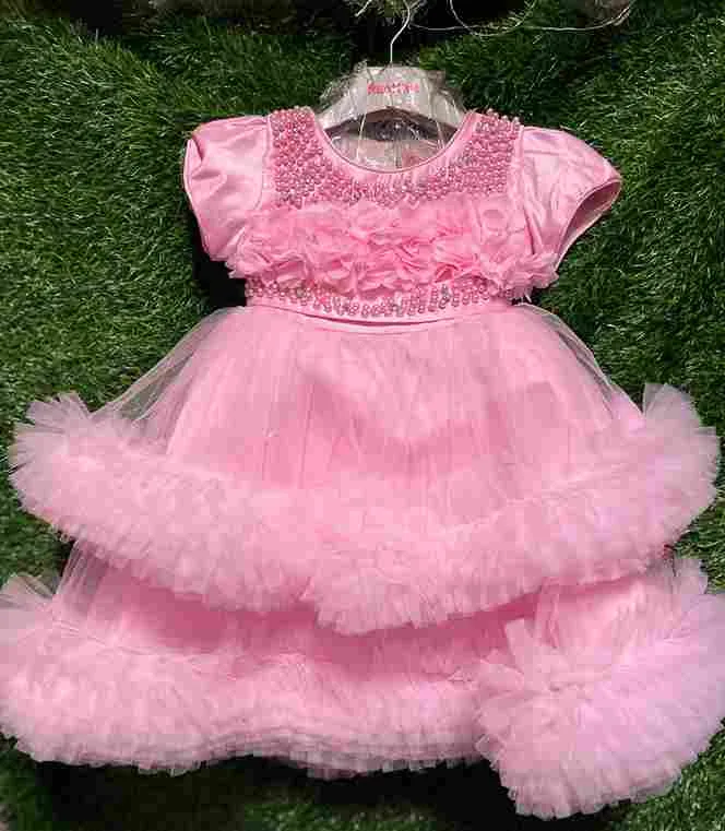 Pink fluffy tulle gown with pearl neckline and 3D flower details