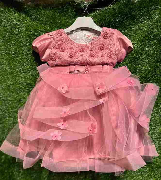 Pink layered tulle gown with embroidered bodice, pearl waistband and 3D flower scattered on the skirt