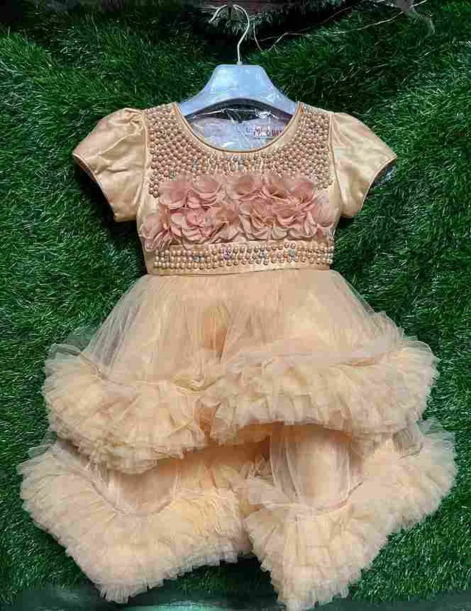 Gold/champagne layered tulle gown with pearl neckline and 3D flower detail on the chest