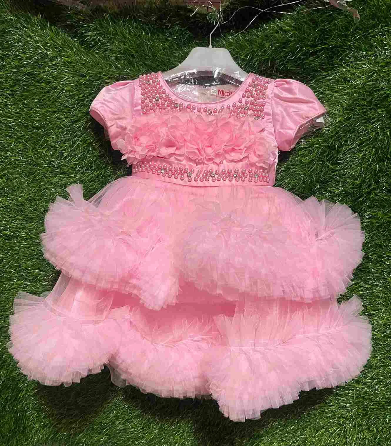 Pink tulle gown with pearl neckline, 3D flowers and layered ruffled skirt