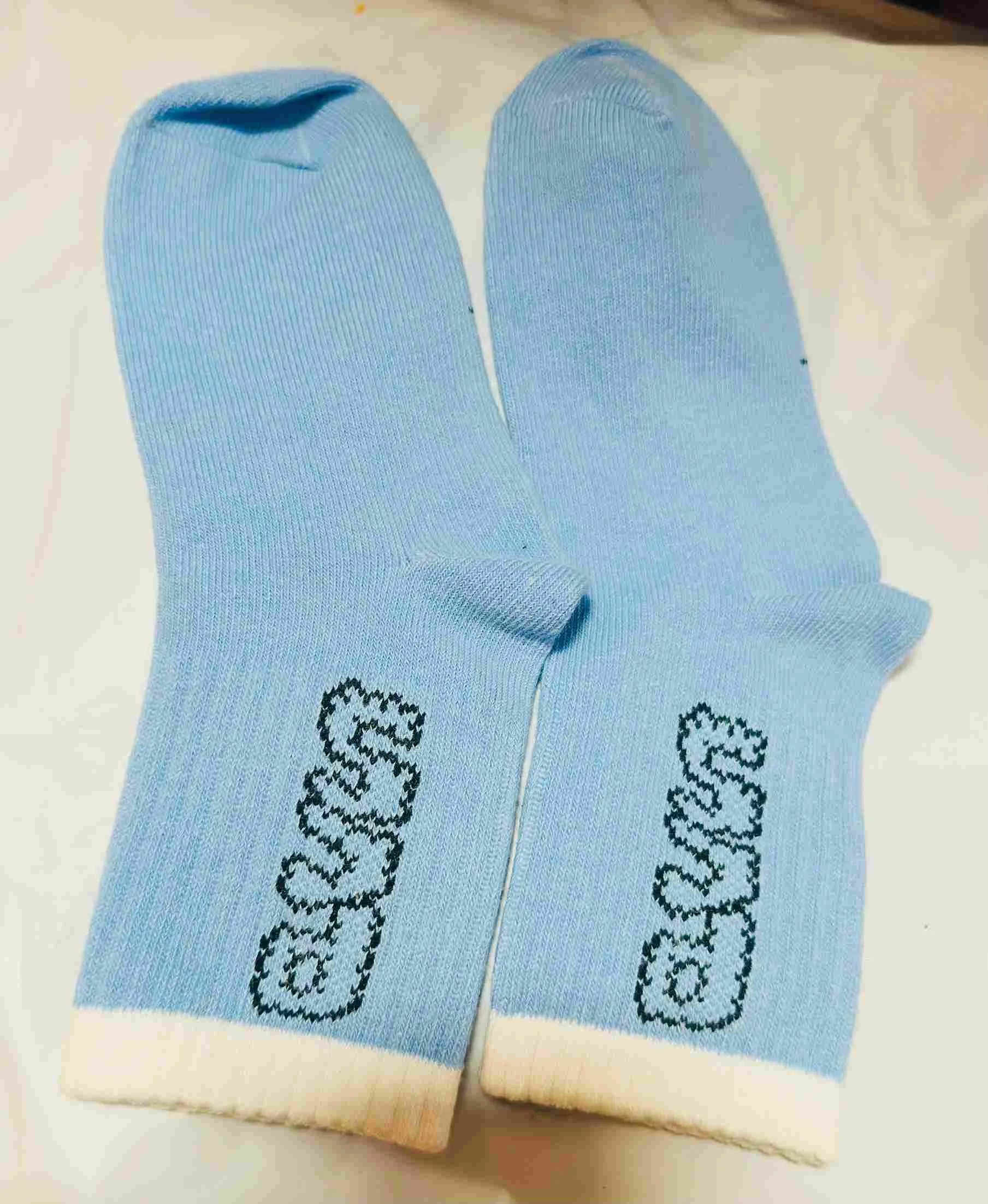 Baby blue crew socks with text print