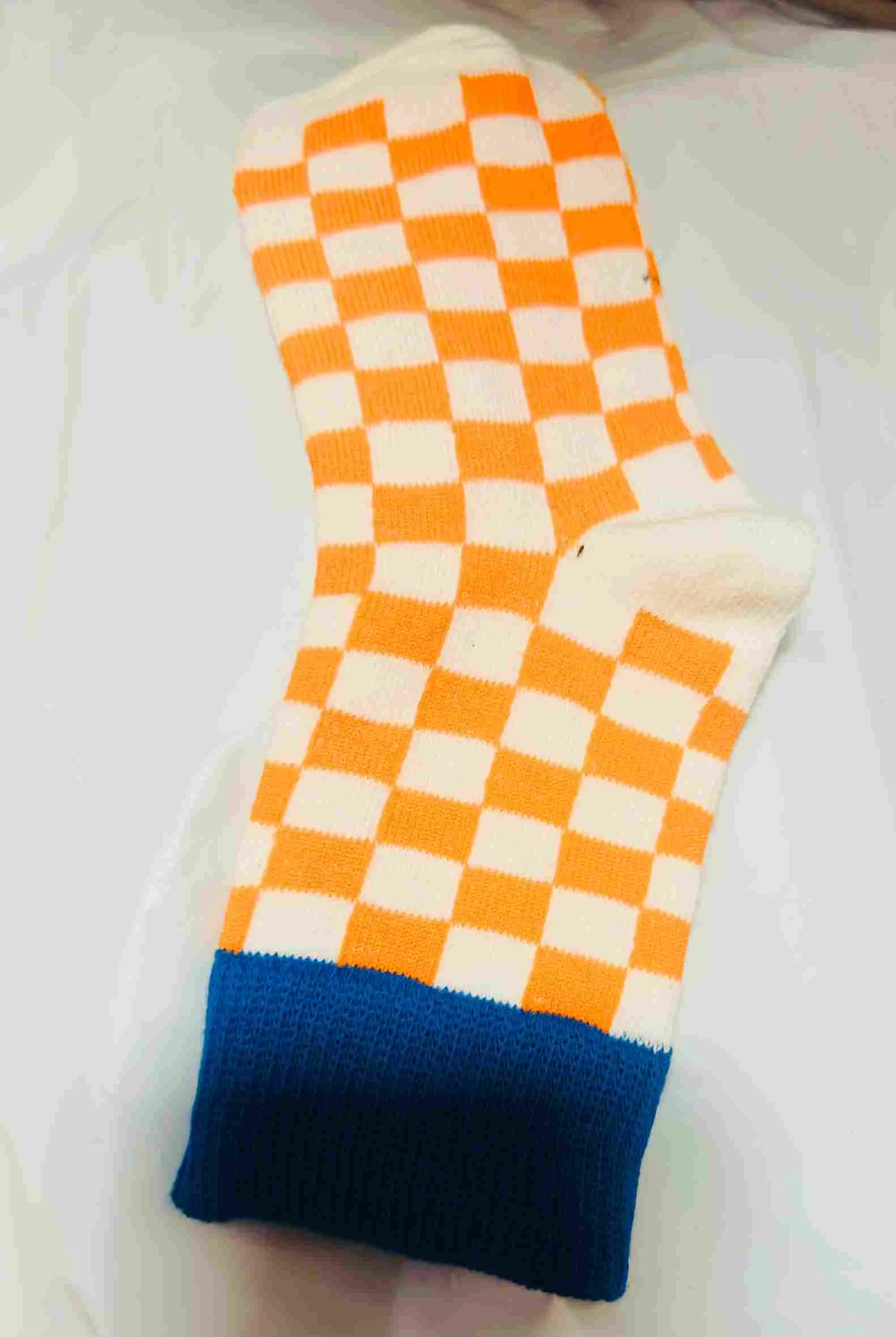 Orange & white checkerboard pattern socks